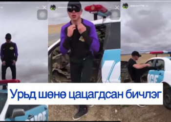 Цагдаагийн машины цонхыг хагалж, дээр нь бүжиглэсэн залуу …