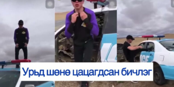 Цагдаагийн машины цонхыг хагалж, дээр нь бүжиглэсэн залуу …